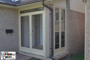 Home 31 Glass porch enclosure with storm door on a Vaughan home